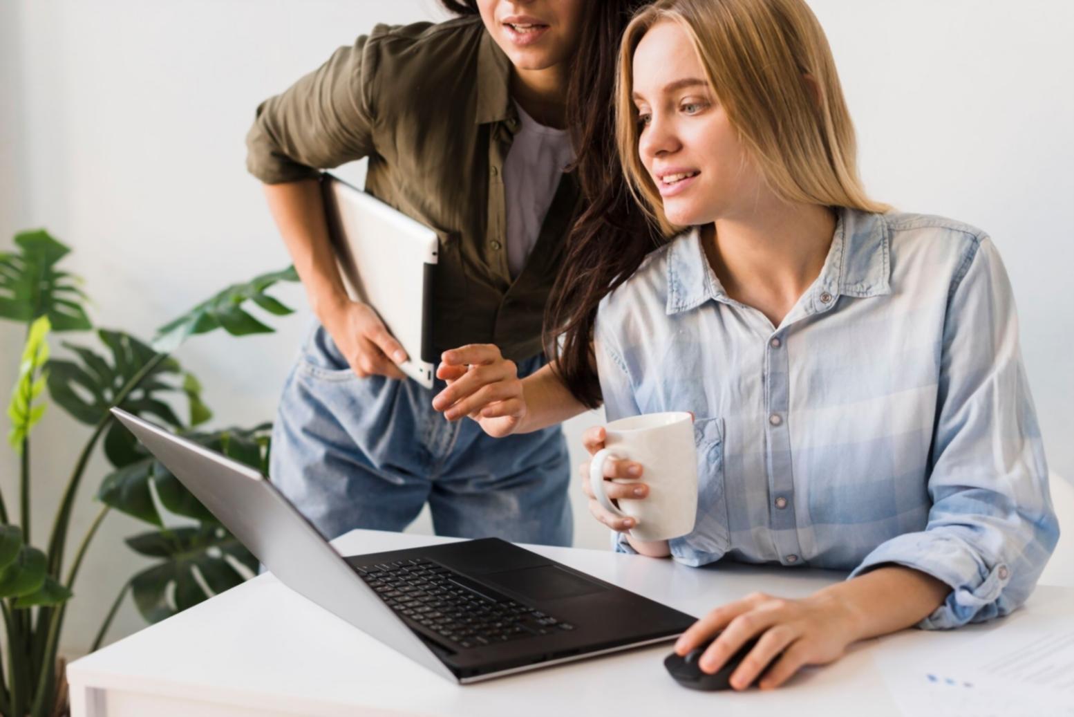 Business owner using mobile device to review automatically categorized monthly expenses